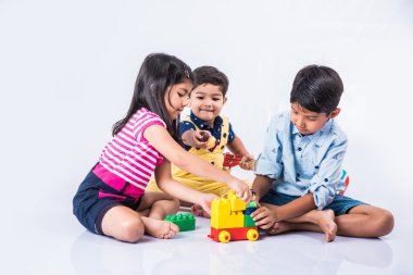 depositphotos_115373012-stock-photo-indian-kids-playing-with-block