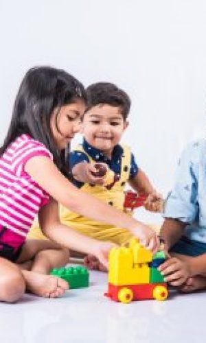 depositphotos_115373012-stock-photo-indian-kids-playing-with-block